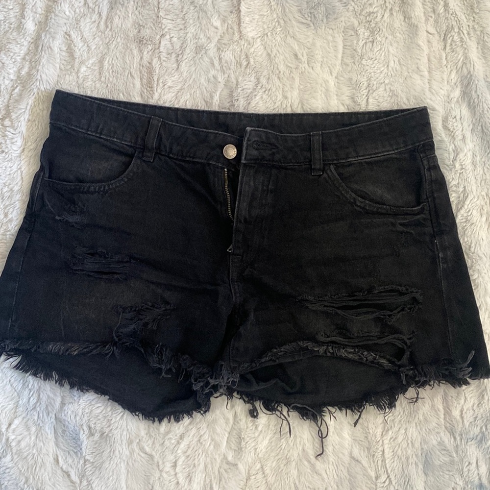 Medium sized black ripped shorts